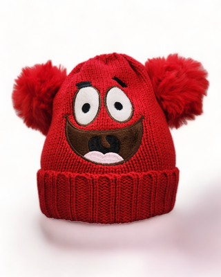 Red  knit hat with two pom poms and a smiley face