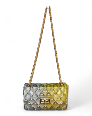 A stylish quilted jelly crossbody bag in an ombre design of blue and green shades with a gold chain strap and clasp.