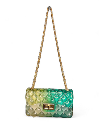 A fashionable quilted jelly crossbody bag in an ombre design of green and blue shades with a gold chain strap and clasp.