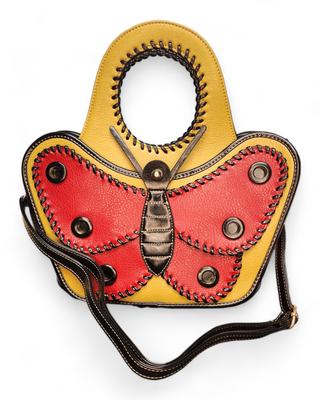  A butterfly-shaped handbag made of faux leather with red and yellow wings, black handles, and a detachable shoulder strap.