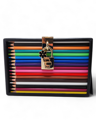 Vibrant crossbody bag featuring real colored pencils arranged vertically, with a compact size and an adjustable strap, displayed on a clean, white background