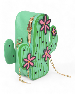 "Green cactus-shaped bag with pink flower accents and a gold chain strap."