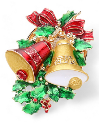 A festive magnetic brooch featuring a red and gold bell design surrounded by green holly leaves and topped with a red bow. The brooch is detailed with rhinestones and uses a magnet for attachment, eliminating the need for pins.