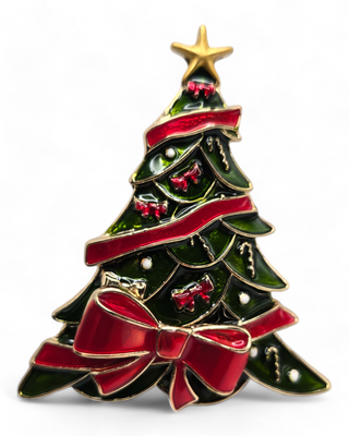 A Christmas tree-shaped brooch featuring a red bow, gold star, and decorative ornaments. The tree has a glossy enamel finish with green branches, red ribbons, and gold accents