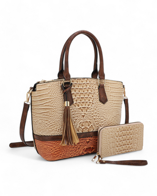 A croc-embossed satchel with matching wallet, featuring tassel detailing and a structured silhouette.