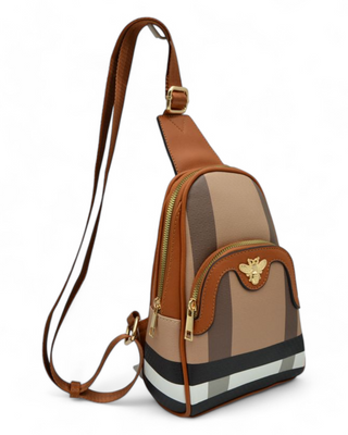 Stylish crossbody bag with gold zipper details and a bee emblem, featuring an adjustable strap and structured design