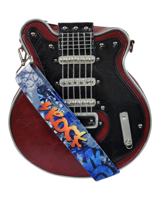 A red and black guitar-shaped handbag with a detailed front design featuring guitar strings, metallic accents, and studded embellishments. The bag includes a colorful, graffiti-style strap that reads "ROCK."