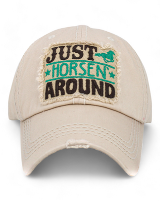 distressed baseball cap featuring an embroidered patch with the text "Just Horsen' Around" and a playful horse graphic,