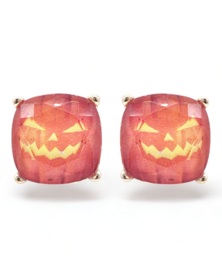 A pair of Jack-O'-Lantern stud earrings with an orange pumpkin design featuring a classic carved face, set in a cushion-cut shape with a sparkling finish.