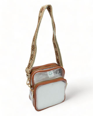 Clear shoulder bag with guitar strap and brown trim.