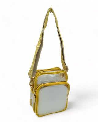Clear shoulder bag with guitar strap and yellow trim.