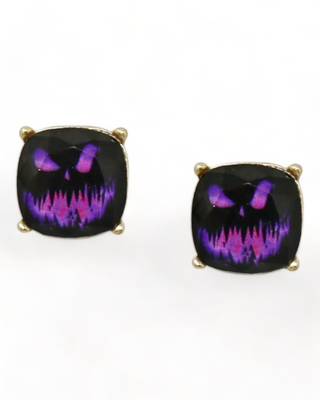 A pair of Jack-O'-Lantern stud earrings with an black pumpkin design featuring a classic carved face, set in a cushion-cut shape with a sparkling finish.