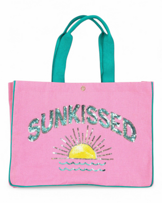 A summer tote bag with "SUNKISSED" in shimmering sequins and a radiant sun design, finished with coordinating handles and trim for a bold, beachy vibe.