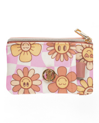 A small zippered wallet with a clear ID window, featuring a cheerful floral print on a checkered background with gold-tone hardware.