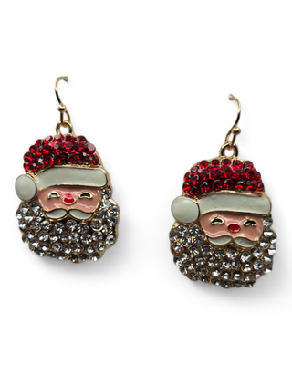 A pair of Santa-themed dangle earrings featuring a red rhinestone hat, a cheerful face, and a glittering crystal beard. 