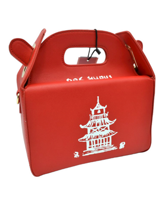 A red Chinese takeout box bag with a white pagoda print, playful handle details, and a detachable shoulder strap.