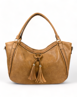 A vegan leather hobo bag with tassels