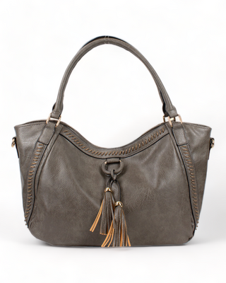 A charcoal gray vegan leather hobo bag with tassels