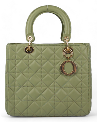 A green quilted handbag with rounded handles, accented by gold-toned metal rings and a circular charm.