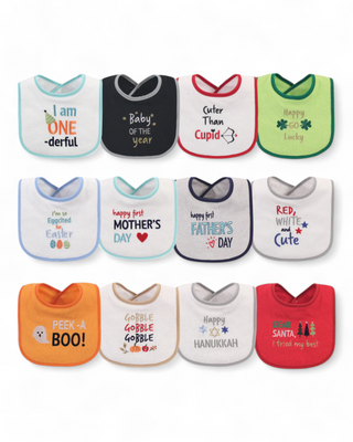 A 12-piece cotton/poly blend baby bib set with Velcro closures, featuring festive designs for various occasions like Mother’s Day, Hanukkah, Halloween, and Christmas, along with other playful milestone messages.