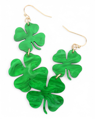 A pair of dangling shamrock earrings with three marbled green clovers in a cascading design, attached to gold-tone fishhook hooks.