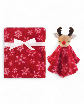 A red snowflake-patterned fleece blanket made of polyester, paired with a reindeer plush security blanket featuring a red nose and antlers.