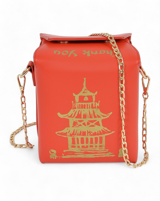 red takeout box-shaped handbag with gold pagoda artwork and “Thank You” text, featuring a gold chain strap.