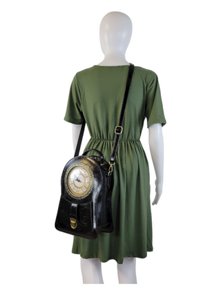 Black crossbody with a working clock face on a mannequin