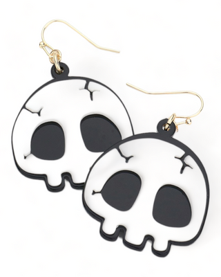 Acrylic black and white skull-shaped dangle earrings with a minimalist design